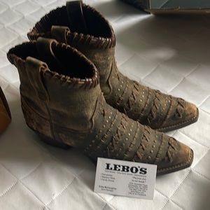 Rawhide cowgirl boots. Worn once. Beautiful design and comfortable.